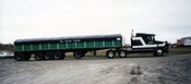 J.C. 5 axle flatbed trailer with tarp and rack