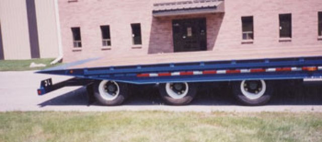 J.C. Sliding axle hydraulic tilt deck trailer