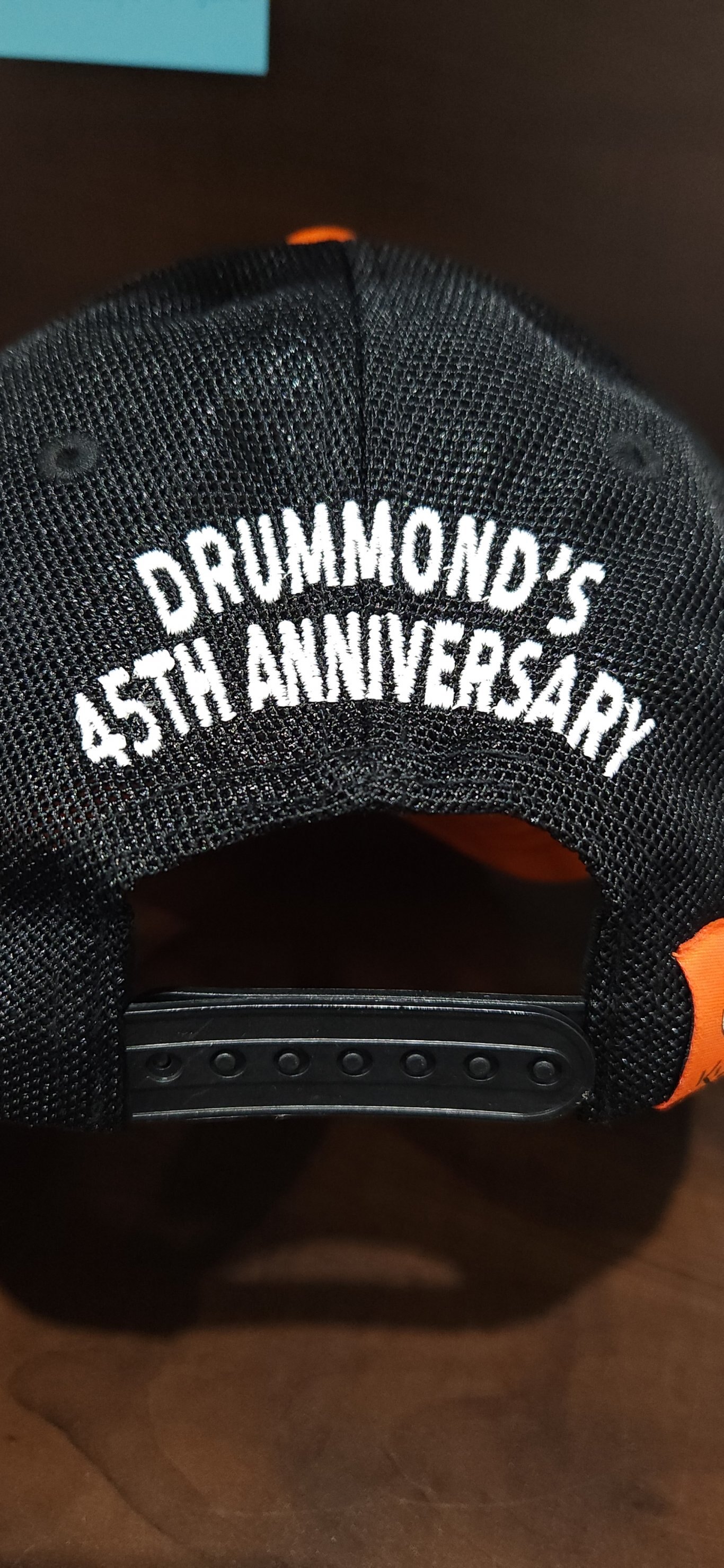 Kubota Limited Edition Drummond's 45th Anniversary Black, Yellow and Orange Hat