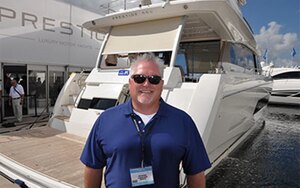 Dave Mayhew of The Boat Warehouse at FLIBS with the Jeanneau Prestige 680